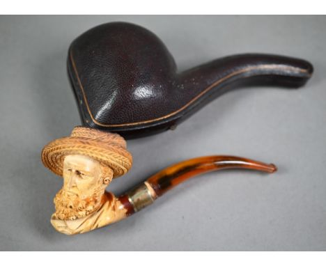 Edwardian Meerschaum pipe, carved as a bearded gentleman in a straw hat, on silver-mounted amber stem, Birmingham 1906, in ve