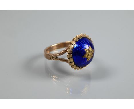 A Victorian ring of blue enamel domed design with inset star motif, 9ct yellow gold set, size P 