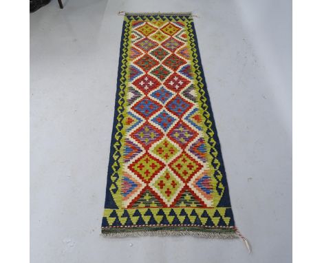 A Chobi Kilim Runner. 186cm x 60cm 