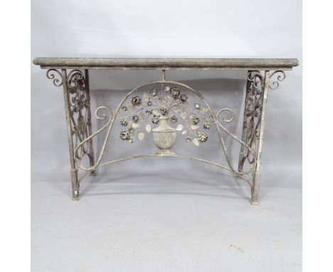 A French design wrought iron console table with decorative ironwork, the folding frame with deliberately distressed finish an