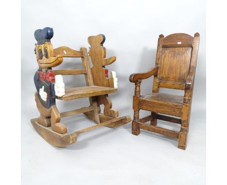 A vintage Oak child's rocking chair with carved and painted Donald Duck decoration, h 72cm and another oak child's armchair h