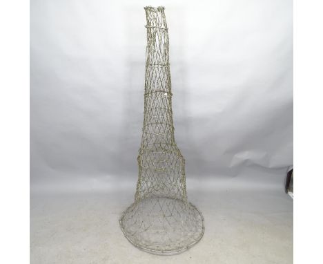 A vintage metal eel trap. Height 160cm. 