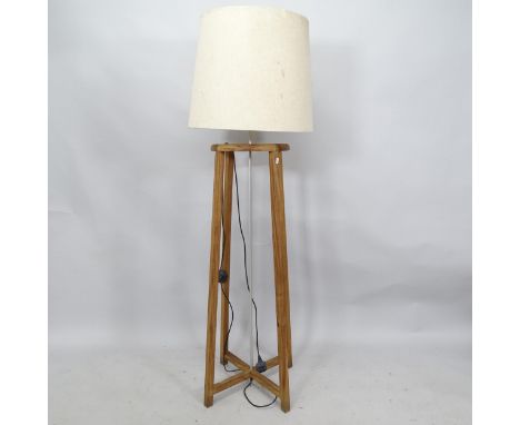 A mid-century teak standard lamp and shade, Height to bayonet fitting 129cm 