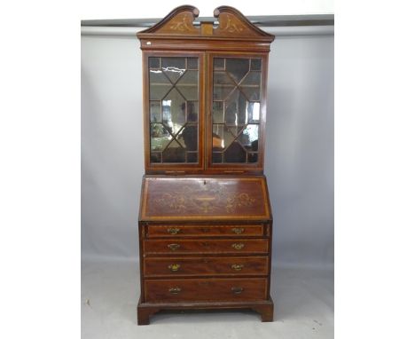 A 19th century crossbanded mahogany and satinwood-strung 2-section bureau bookcase, the fall-front revealing fitted interior 