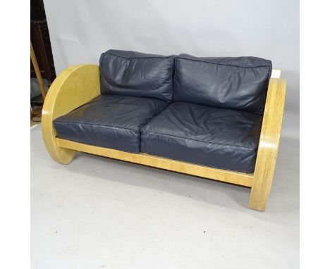 A contemporary craftsman made knock down sofa in laminated birch, of Art Deco style with leather cushions and prominent maker