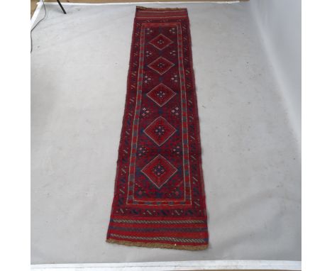 A red ground Meshwani runner, 244 x 59cm 