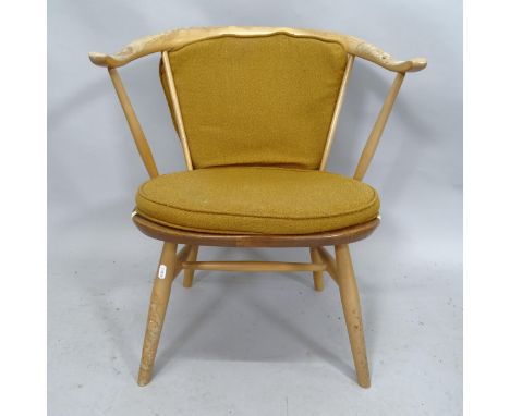 A mid-century Ercol elm model 338 bow arm chair. 58cm x 68cm x 43cm 