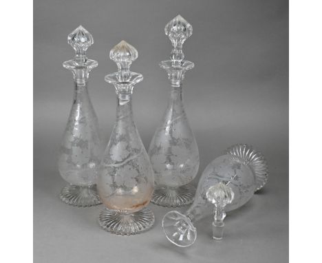 A set of four Victorian cut glass decanters, with profuse vine etching, 34 cm high&nbsp; One stopper matching the others but 