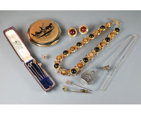 A collection of seven various stick pins, including knot, diamond, amethyst set etc, to/w a silver perfume funnel, a white me