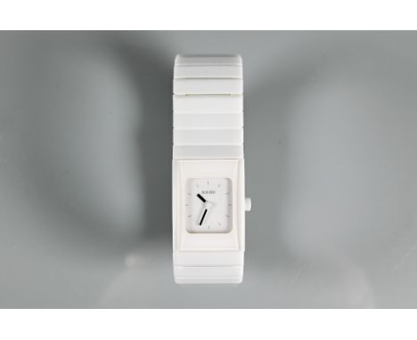 Rado, a white cased lady's wristwatch, quartz movement, on deployment bracelet, with box, manual and warranty card circa 2012