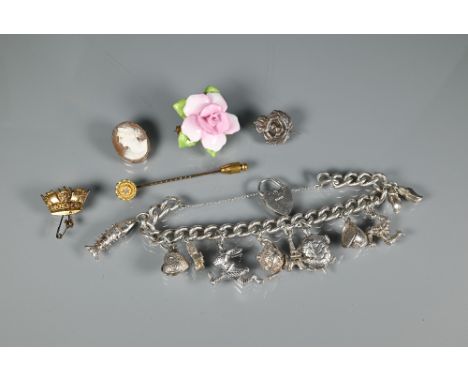 Four various brooches - a 9ct yellow gold coronet brooch (3.4g), a white metal naval lapel badge, a Coalport china brooch in 