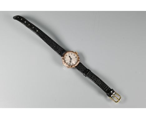 A ladies 9ct Art Deco period wristwatch, the silvered engine turned dial with Roman numerals, manual jewelled swiss movement,