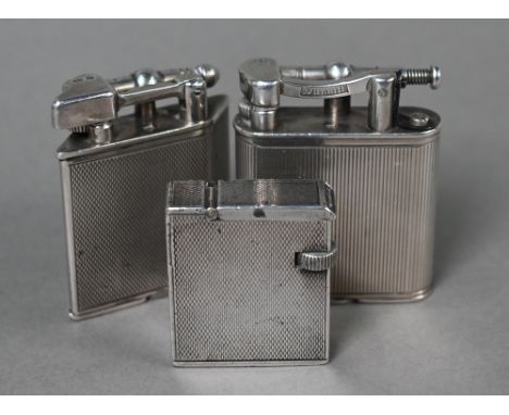 Two Dunhill silver cigarette lighters, London 1940/51, to/w a Parker Beacon cigarette lighter of parallelogram form with engi