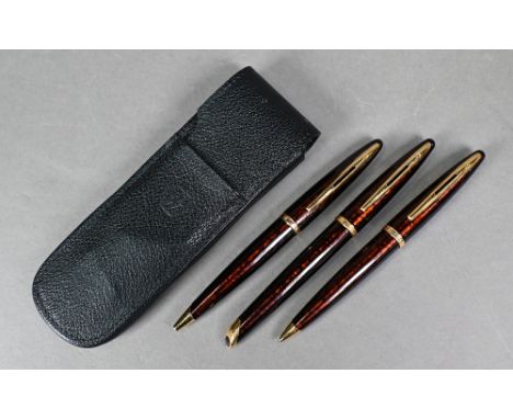 A Waterman (France) 'tortoiseshell' fountain pen, ballpoint pen and pencil set (fountain pen with 18k nib) in original leathe