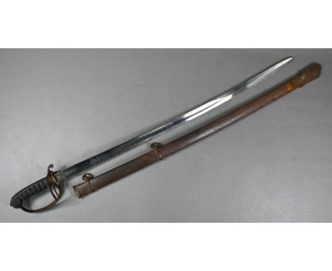A Victorian cavalry sword with 82 cm slightly curved and fullered blade, etched with crest and 'RTF' initials, on open basket