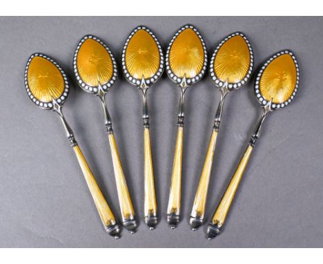 An Edwardian set of six enamelled silver coffee spoons with gilt bowls, London import 1902Enamel; Some minor losses to beads 