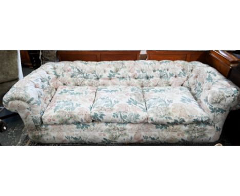 A Victorian traditional button backed Chesterfield sofa, presented in Sanderson floral print fabric, 240 cm x 94 cm x 70 cm h