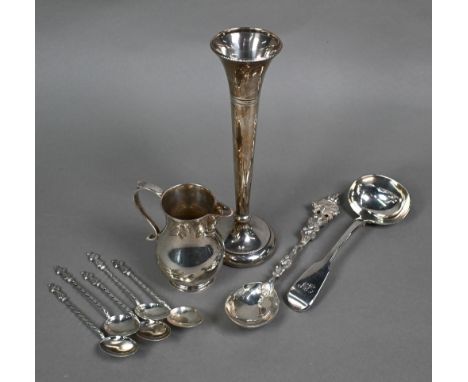 A heavy quality silver baluster cream jug, Spink &amp; Son, London 1976, to/w a cabinet spoon cast with Royal emblems, London