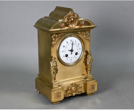 An architectural form brass cased mantel clock, the white enamelled dial decorated with floral garlands and Arabic numerals, 