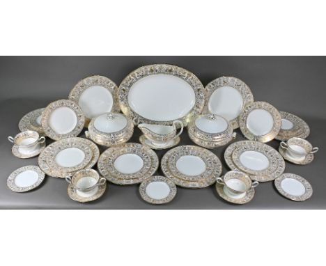 A Wedgwood Gold Florentine dinner service for eight settings, including dinner plates, dessert plates, soup bowls and saucers