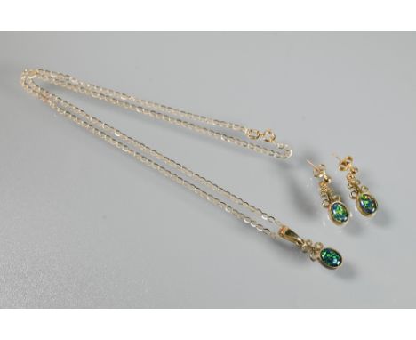 A black opal doublet pendant and earring set in the Arts and Crafts style, set 9ct yellow gold, suspended from 18ct yellow go