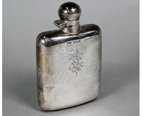 An Edwardian silver hip flask with hinged bayonet bun cover and detachable beaker, James Dixon &amp; Son, Sheffield 1909, 6.9