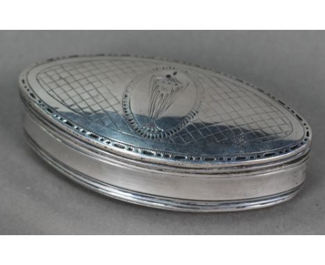 An 18th Century Continental white metal snuff box of elliptical form, the hinged cover engraved with a Classical urn (marks n