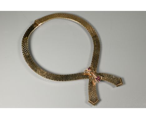 A 1960s 9ct yellow gold collar necklace, of brick link form, with ruby set centrepiece, 40 cm long (open), approx 78g all in,