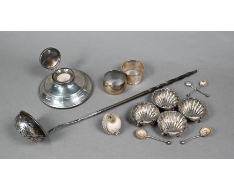 A set of four silver shell salts, Sheffield 1912, to/w two pairs of salt spoons, two napkin rings, a loaded silver capstan in
