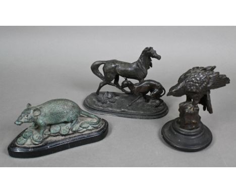 A vintage brown-patinated bronze eagle, perched on a rock, unsigned, an ebonised base, 15 cm high, to/w a spelter group of a 