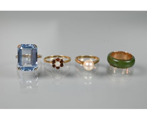 Four various dress rings - a rectangular synthetic blue stone, 9ct yellow gold set, a 9ct yellow gold ring set single pearl, 