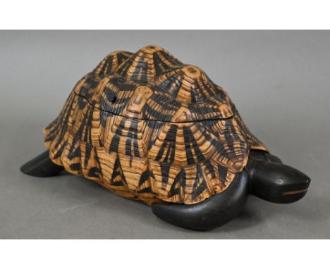 An Indian trinket box, constructed from a tortoise shell on ebony body, the hinged top enclosing parquetry inlaid lining with