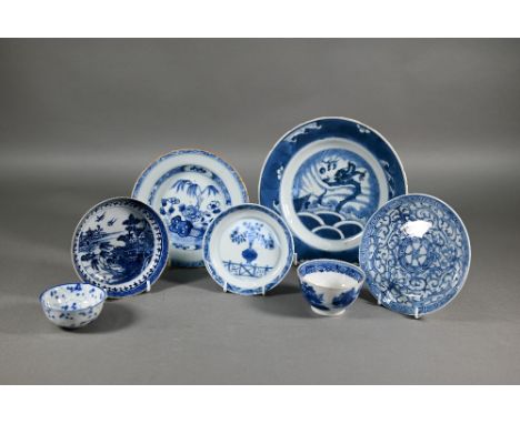 A group of 18th century Chinese blue and white ceramics including a Kangxi period dragon and carp plate, 21 cm diameter; a sm