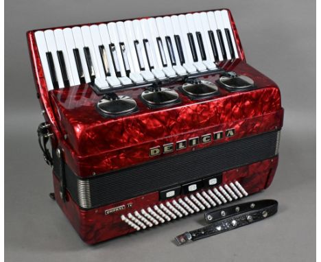 A Delicia Choral IV piano accordion with red marbled body, c/w carrying case