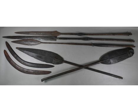 Three antique African tribal (possibly Congolese) spears with broad iron heads, the wooden shafts with carved central pommel 
