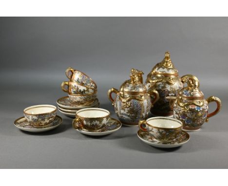 A Japanese Satsuma tea service by Hododa, comprising teapot, milk jug and sugar bowl all with covers and bright gilded dragon