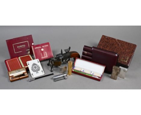 Dunhill - a Tinder-Pistol and five other cigarette lighters, a cased cheroot-holder, slender cigarette holder and boxed cigar