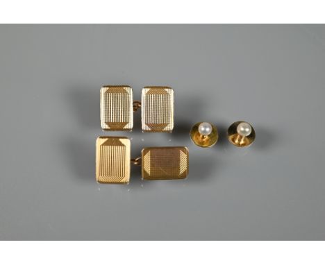A pair of 9ct yellow gold rectangular engine-turned chain-linked cufflinks, approx 8.8g to/w two unmarked pearl-mounted studs