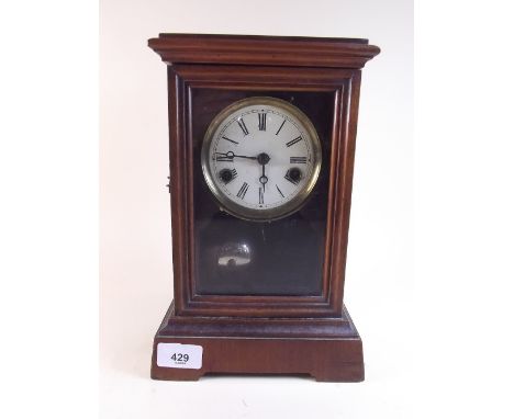 An architectural style mantel clock with interior bell