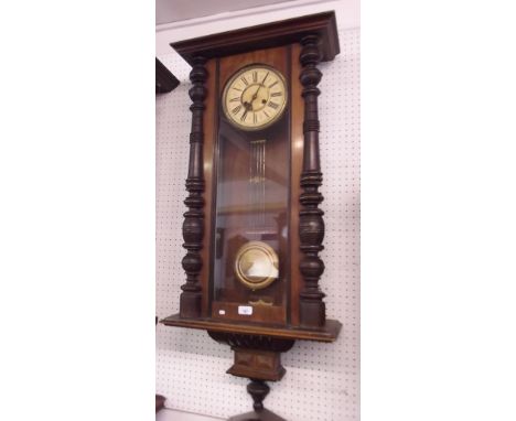 A 19th century Vienna style wall clock with architectural mahogany case