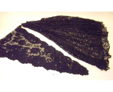 A black lace skirt and a black lace triangular scarf with scalloped edging