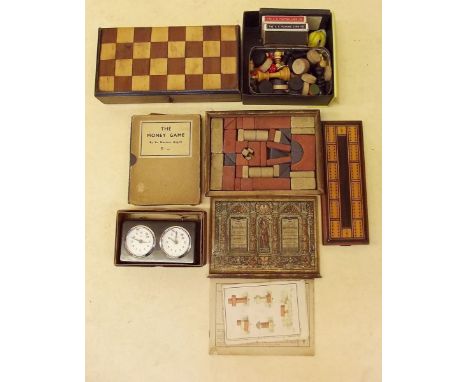 A chess clock, games board and various other toys and games