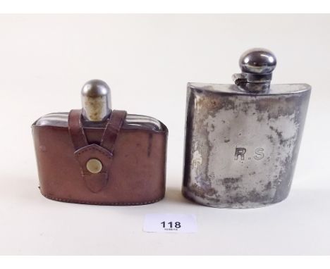 A silver plated spirit flask and a leather clad spirit flask