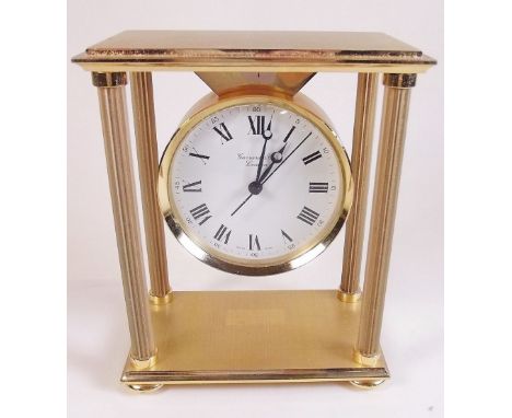 A Garrard and Co brass mantel clock with pillar design - boxed