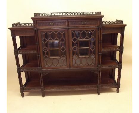 A Victorian mahogany Chippendale style display side cabinet with blind fretwork and pierced carved decoration