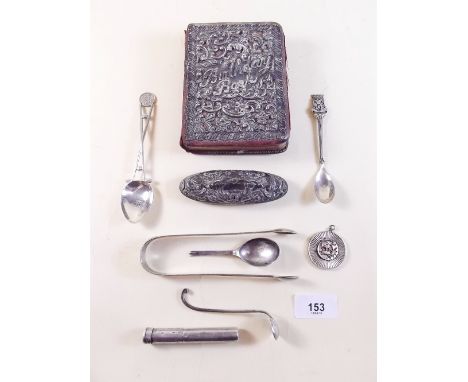 A group of silver items to include silver clad Birthday Book, silver lighter, various spoons, tongs etc