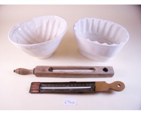 Two 19th century jelly moulds, a cream thermometer and a sweet thermometer