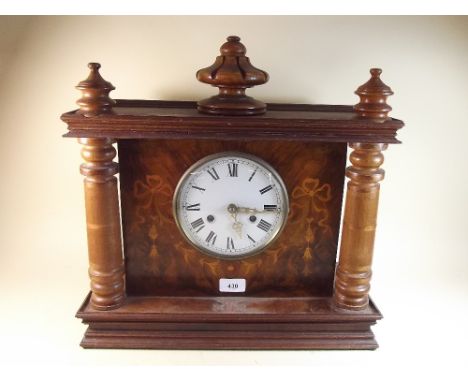 A decorative mantel clock with chiming movement and later made up case