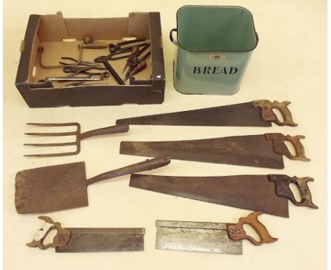 A box of various hand tools and an enameled metal bread bin