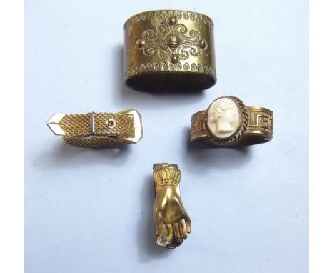 A Victorian hand form scarf clip, a buckle form scarf ring, a cameo one and a brass one